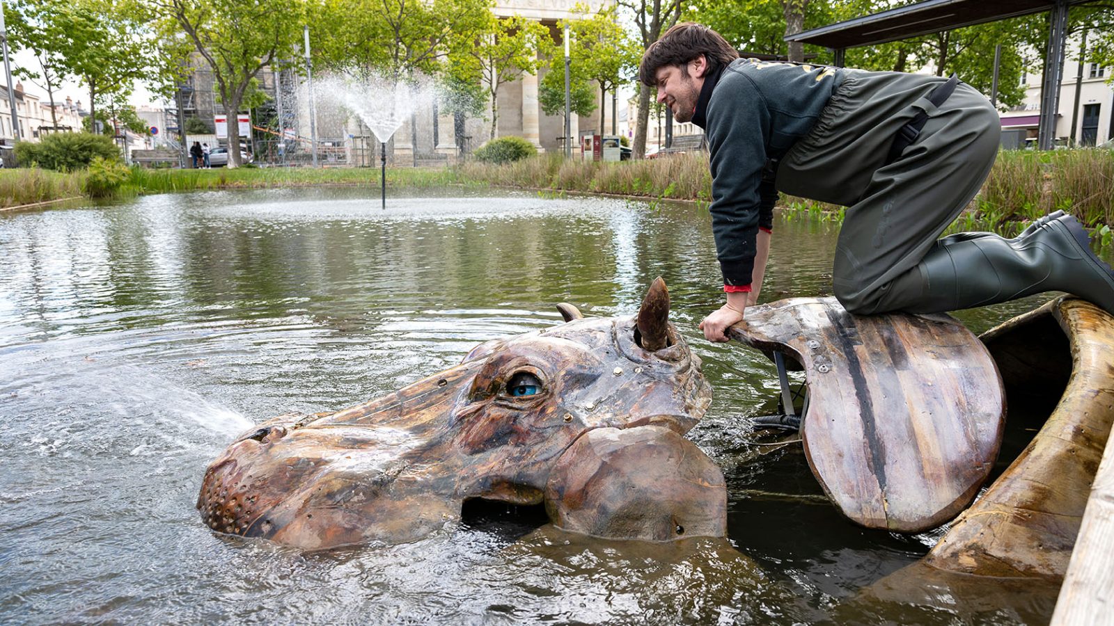 A technician mounted on the back of the mechanical hippopotamus of the Place Napoléon Animals in La Roche-sur-Yon